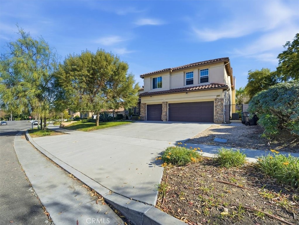 2947 Gilbert Avenue Corona, CA 92881 - Photo 1 of 60 a front view of a house with a yard and trees