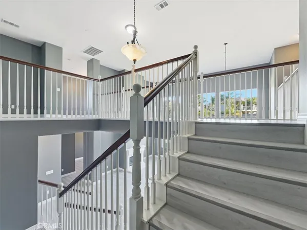 a view of a hallway with stairs