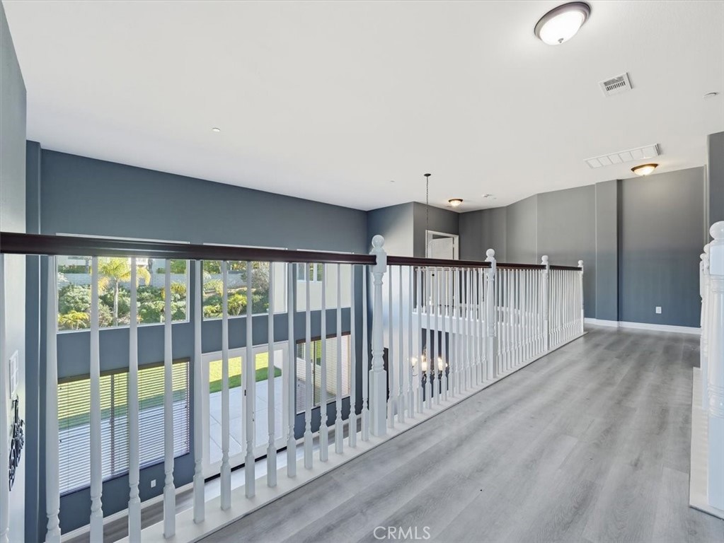 2947 Gilbert Avenue Corona, CA 92881 - Photo 19 of 60 a view of a room with wooden floor