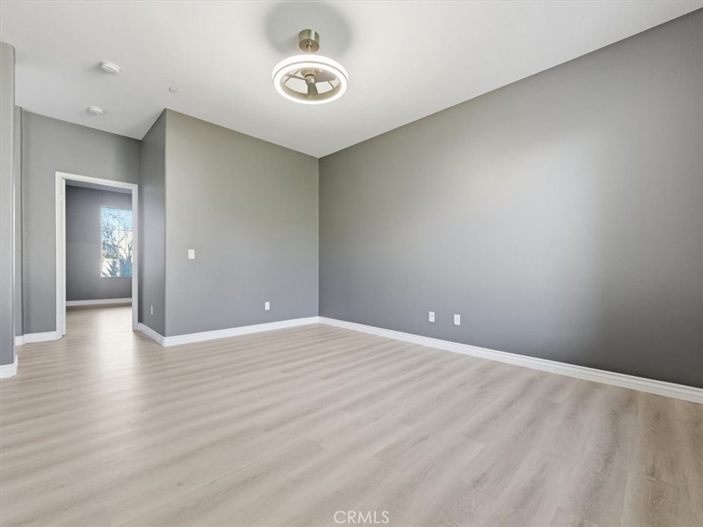 2947 Gilbert Avenue Corona, CA 92881 - Photo 42 of 60 a view of an empty room with wooden floor