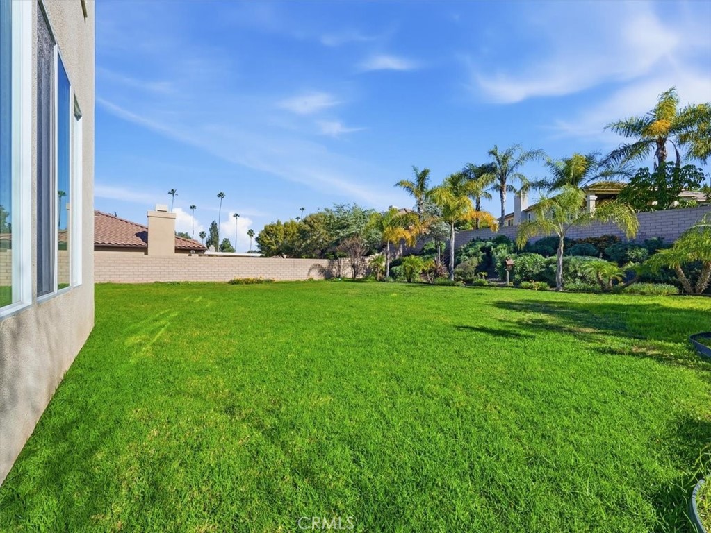 2947 Gilbert Avenue Corona, CA 92881 - Photo 57 of 60 a view of a house with a big yard and potted plants