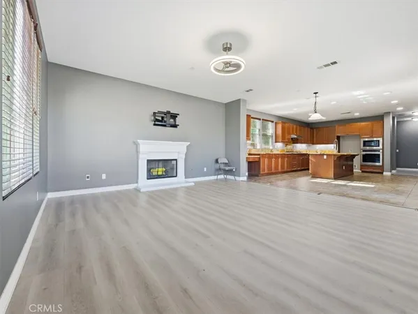 a kitchen with stainless steel appliances granite countertop a stove sink and cabinets