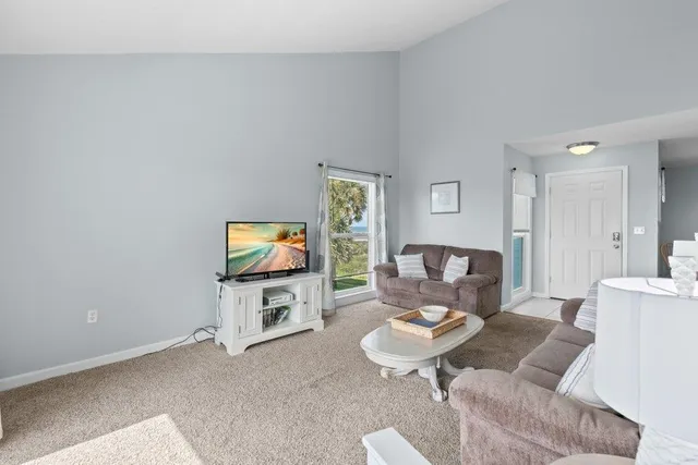 a view of a room with workspace and windows