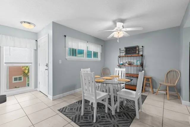a kitchen with stainless steel appliances granite countertop a sink and a refrigerator