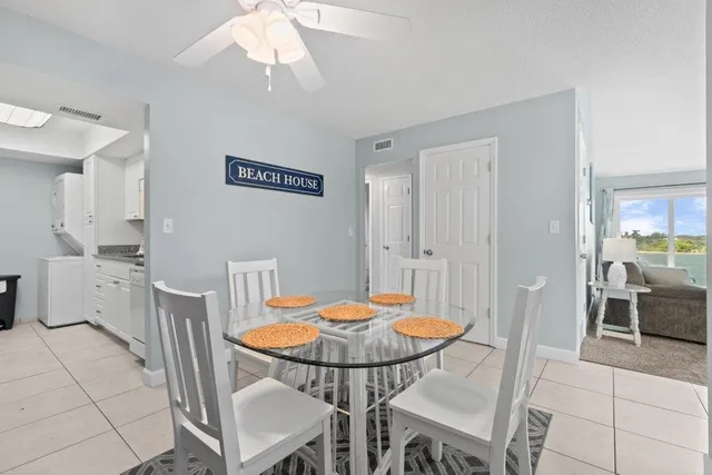 a kitchen with stainless steel appliances granite countertop a sink and a refrigerator