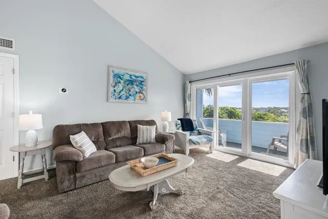 a living room with furniture and a couch