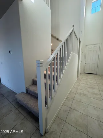 a view of a hallway with staircase