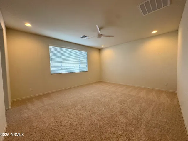 an empty room with a empty space and a window