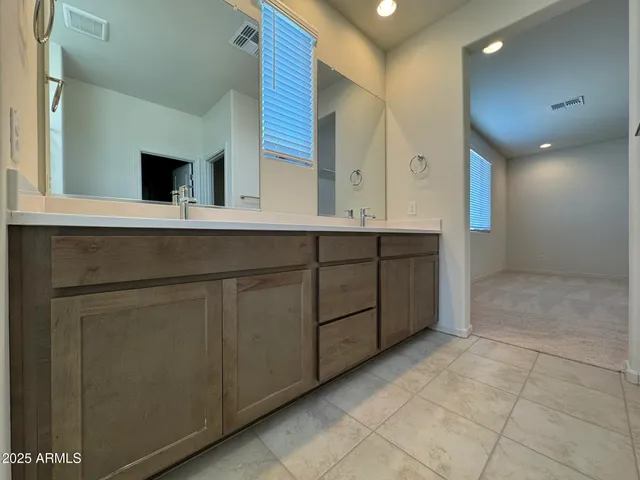a bathroom with a sink and mirror