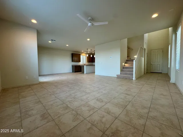 a view of a kitchen with a sink and a refrigerator