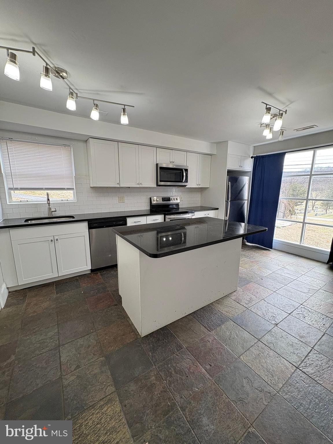 247 Matsonford Road Conshohocken, PA 19428 - Photo 2 of 9 a large kitchen with cabinets a sink and a stove