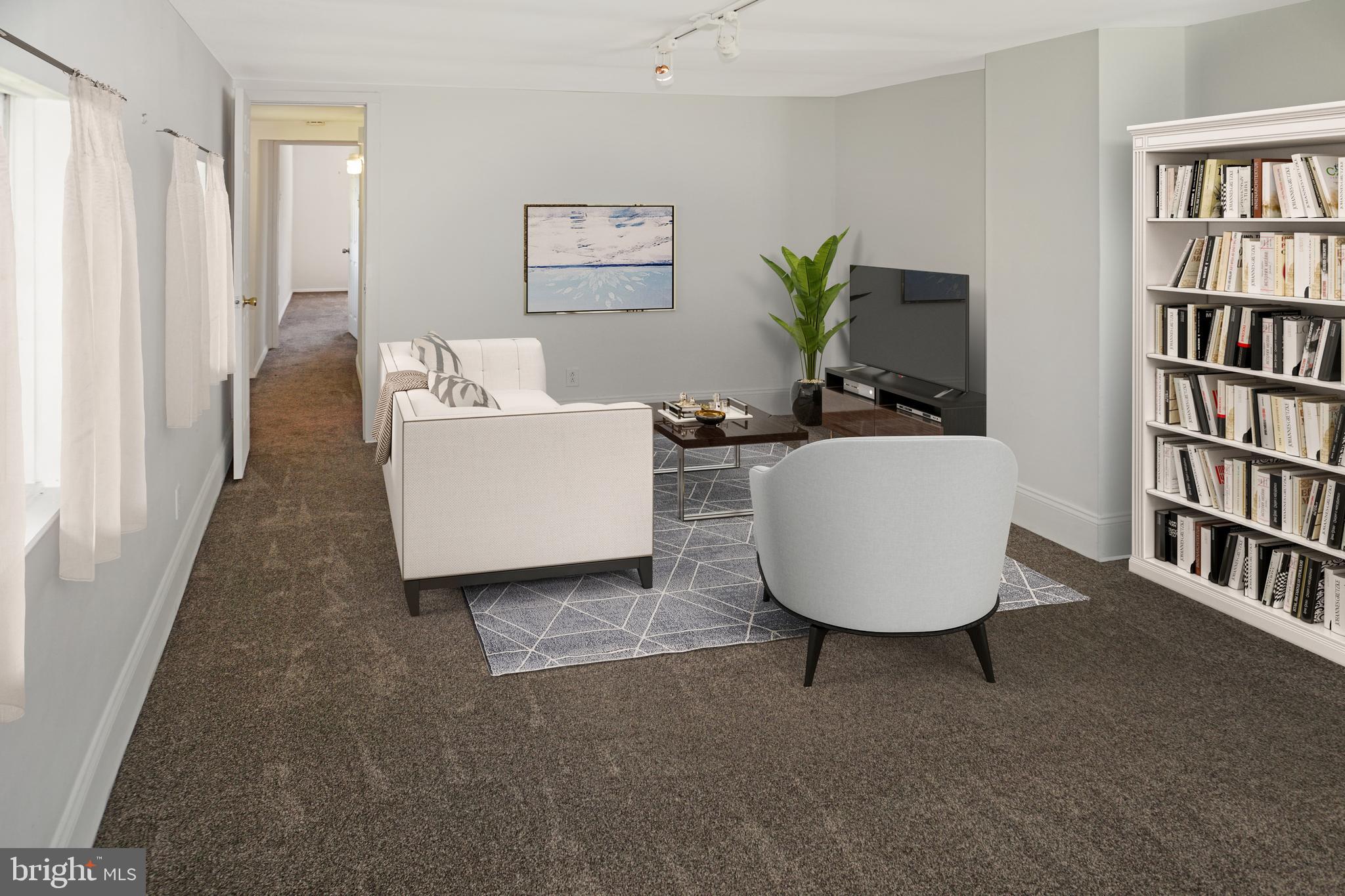 247 Matsonford Road Conshohocken, PA 19428 - Photo 5 of 9 a living room with furniture and a flat screen tv