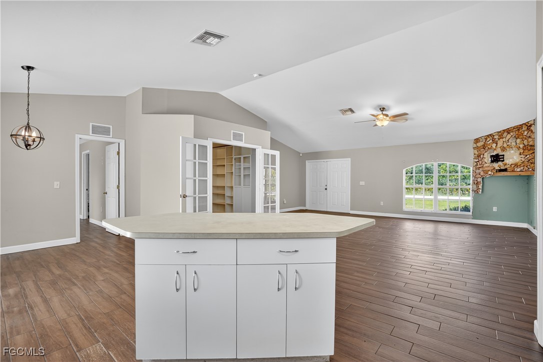 8811 Buckingham Road Fort Myers, FL 33905 - Photo 14 of 30 a view of a kitchen counter space and wooden floor