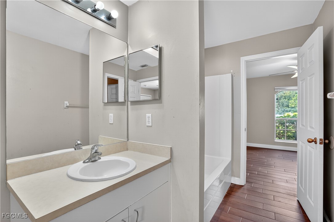 8811 Buckingham Road Fort Myers, FL 33905 - Photo 20 of 30 a bathroom with a sink and a mirror