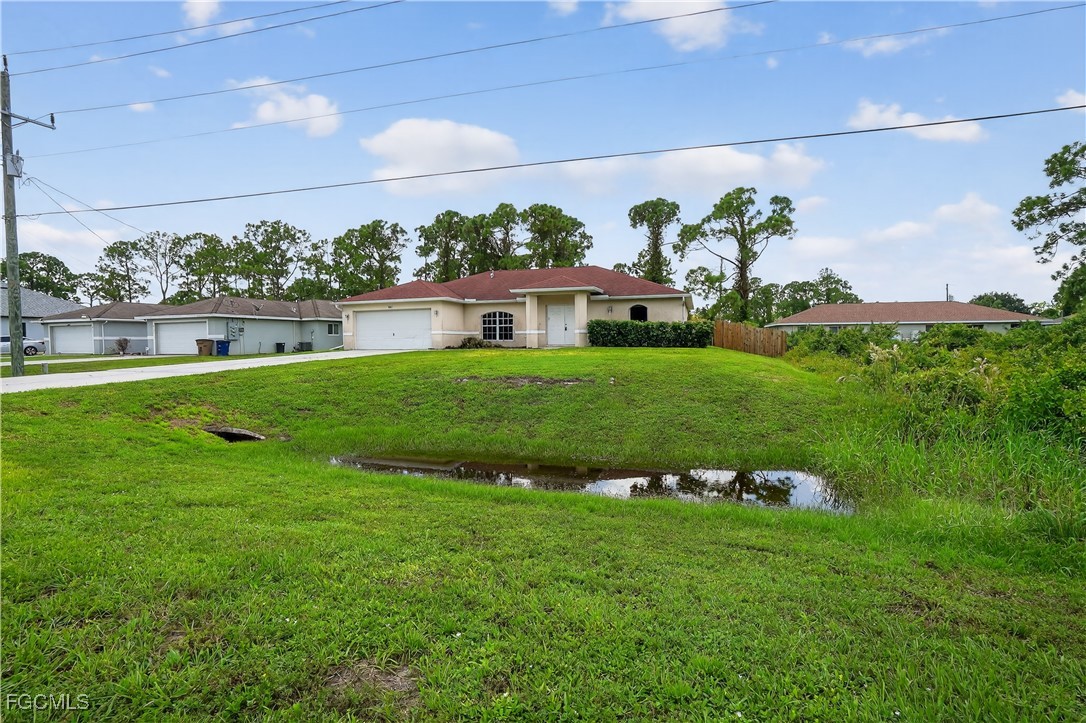 8811 Buckingham Road Fort Myers, FL 33905 - Photo 30 of 30 a view of yard with swimming pool and green space