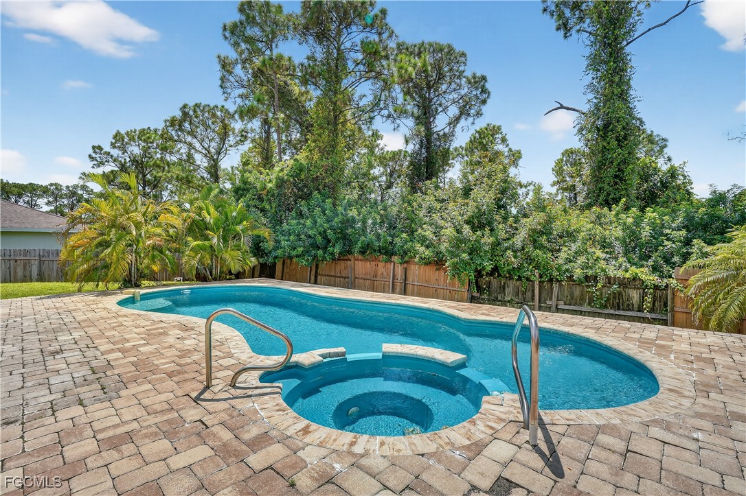 8811 Buckingham Road Fort Myers, FL 33905 - Photo 7 of 30 a swimming pool with outdoor seating and yard