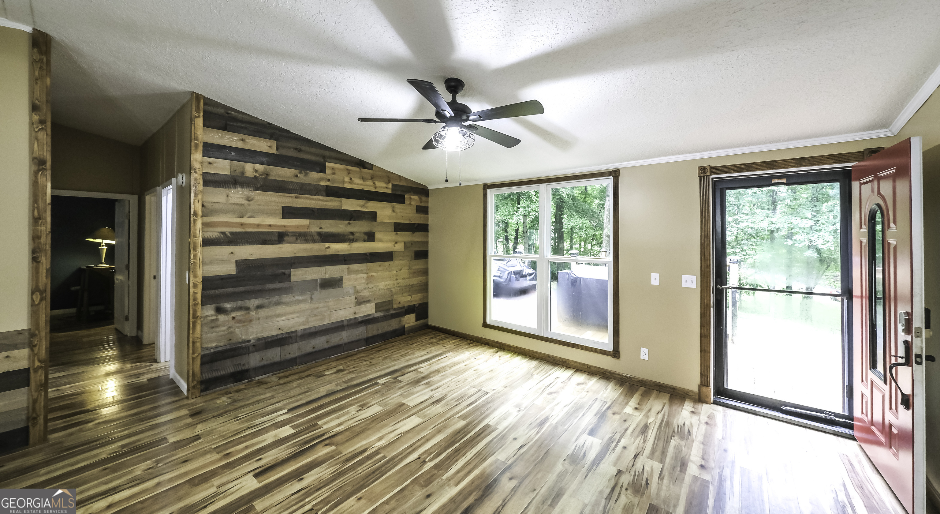 91 Holder Road Temple, GA 30179 - Photo 15 of 40 a view of an empty room with a window and wooden floor