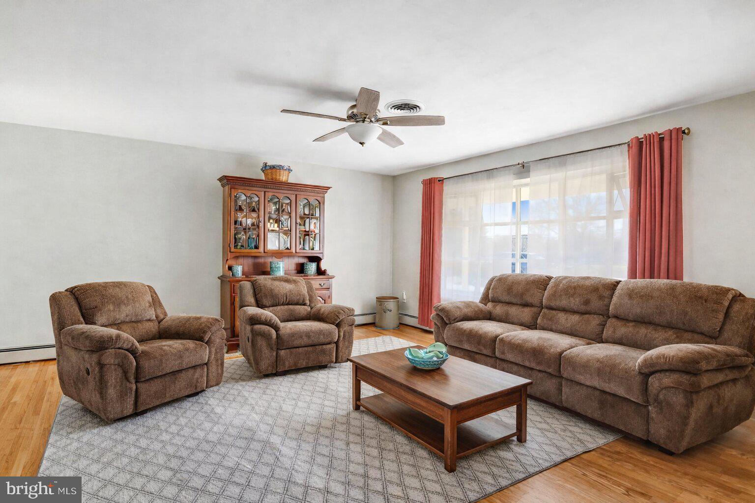 7951 Yellow Springs Road Frederick, MD 21702 - Photo 2 of 22 a living room with furniture ceiling fan and a window