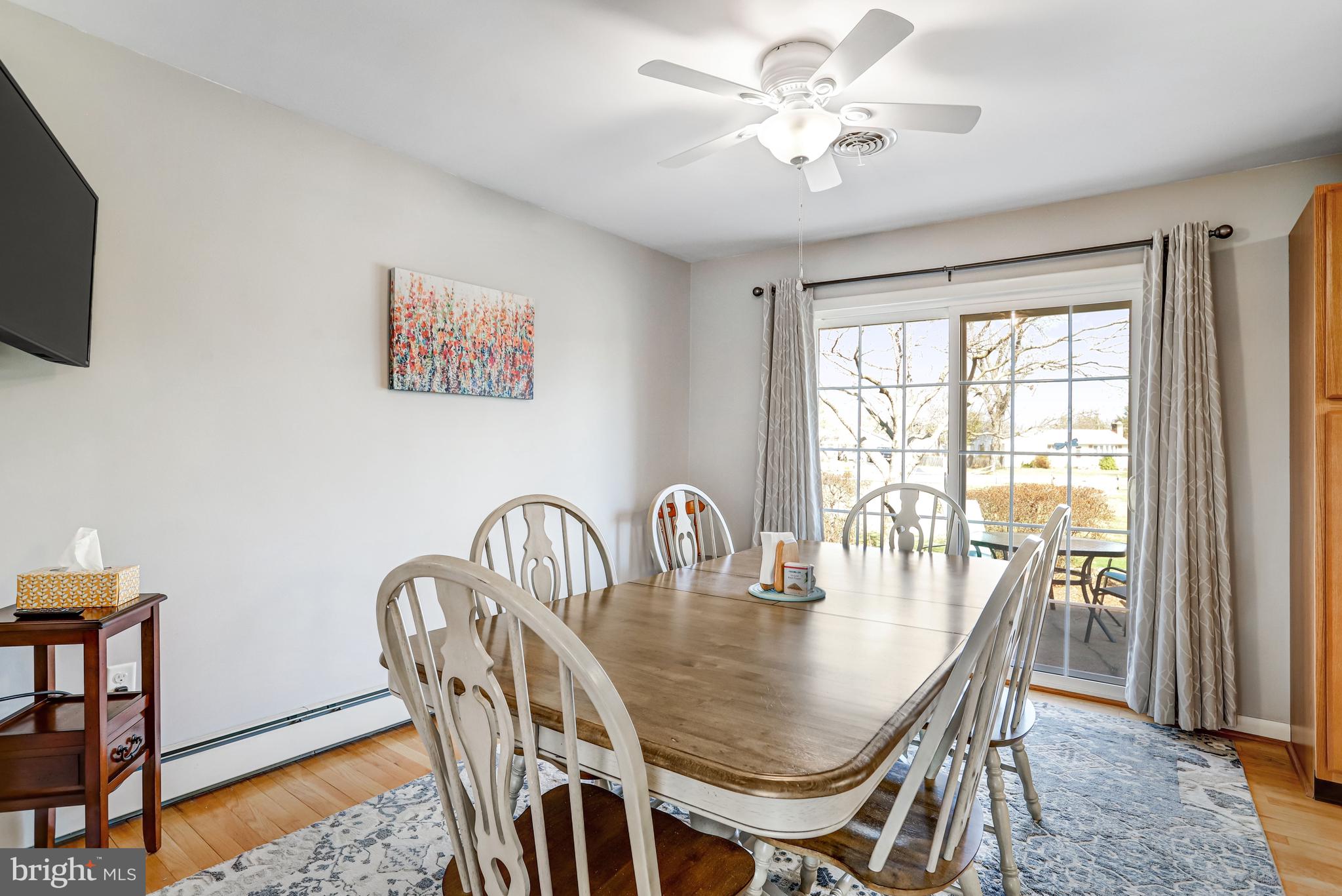 7951 Yellow Springs Road Frederick, MD 21702 - Photo 3 of 22 a view of a dining room with furniture window and wooden floor