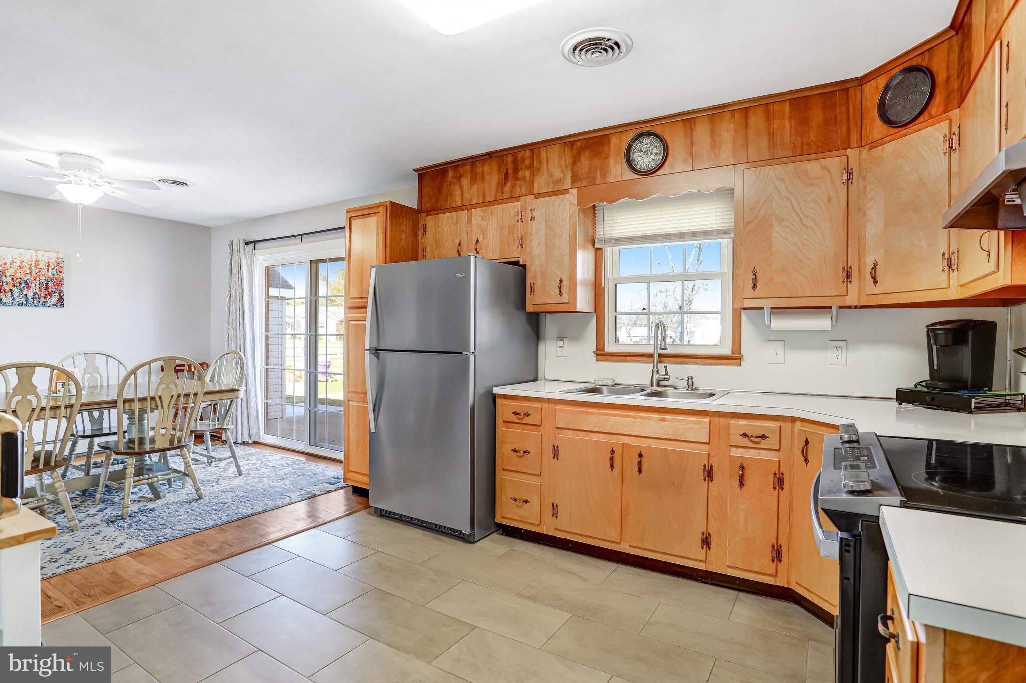 7951 Yellow Springs Road Frederick, MD 21702 - Photo 5 of 22 a kitchen with stainless steel appliances granite countertop a refrigerator and a stove top oven