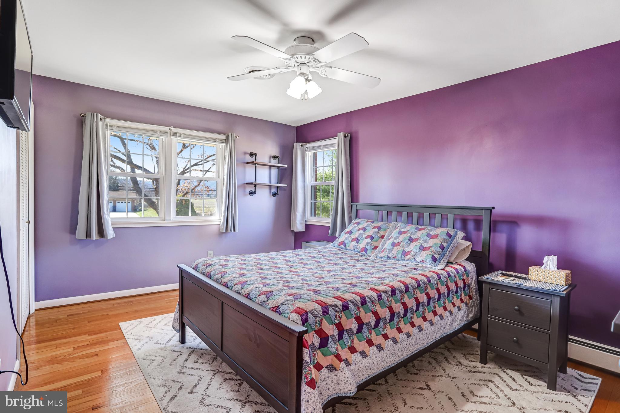 7951 Yellow Springs Road Frederick, MD 21702 - Photo 8 of 22 a bedroom with a large bed and a chandelier