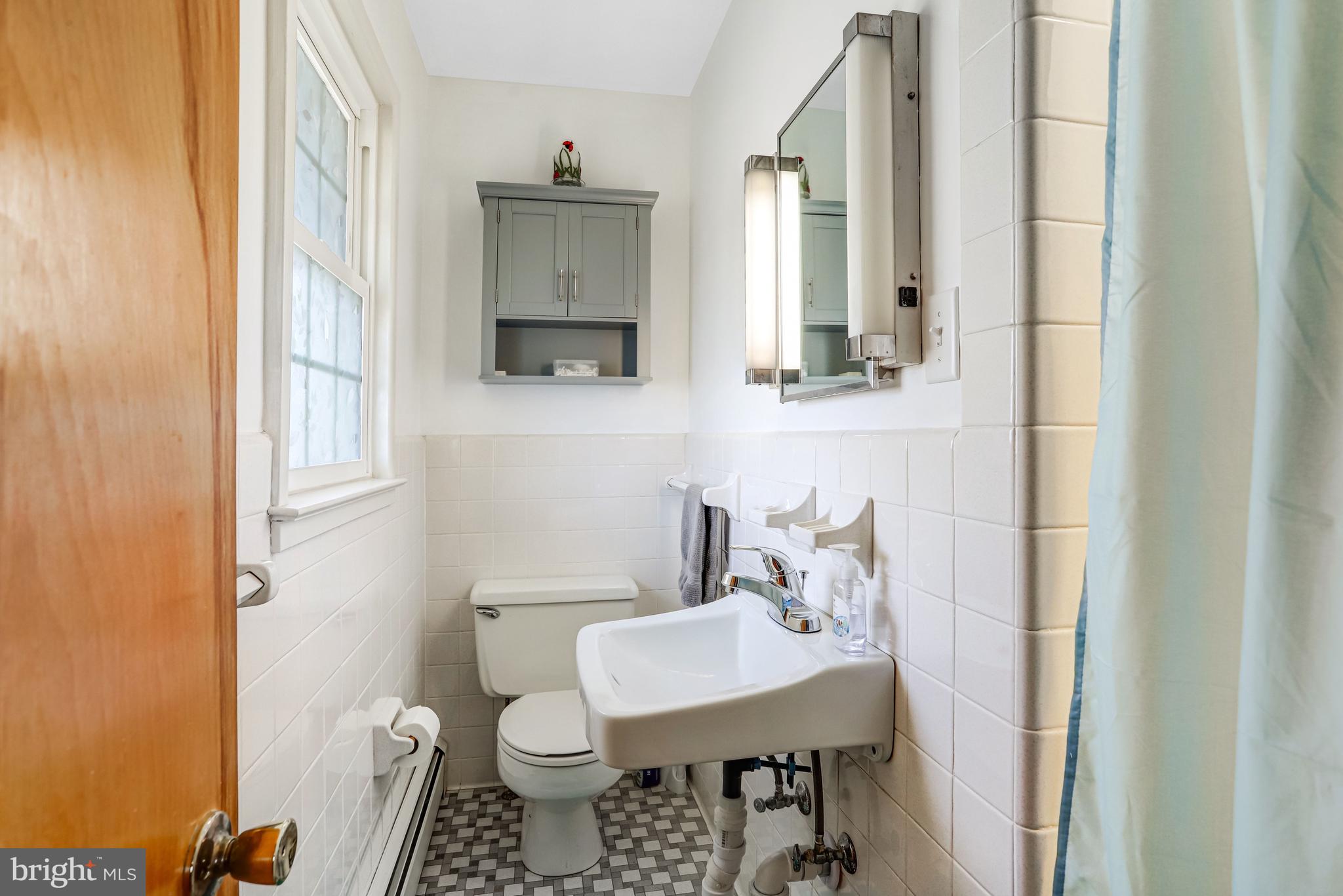 7951 Yellow Springs Road Frederick, MD 21702 - Photo 10 of 22 a bathroom with a sink toilet and mirror