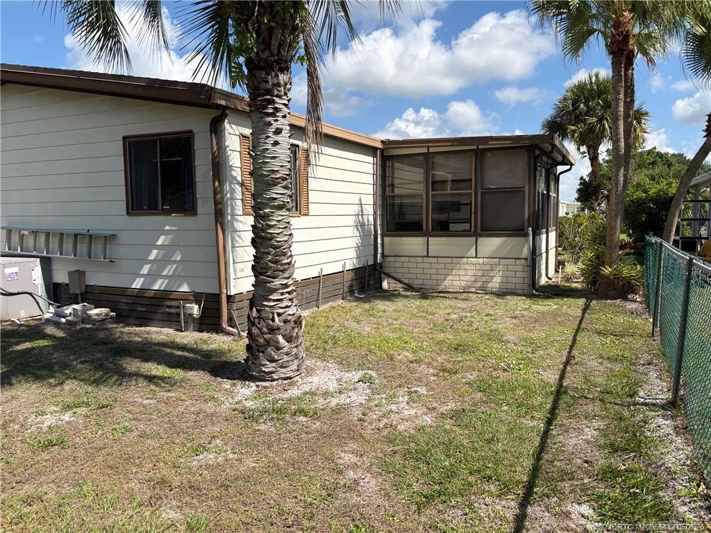 2856 Southwest Toronado Trail Stuart, FL 34997 - Photo 5 of 20 a front view of a house with garden