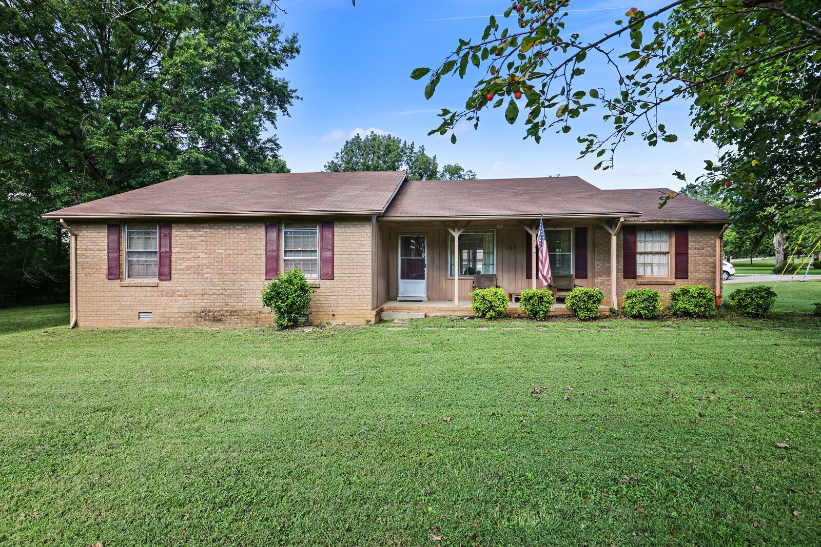 236 Akin Street La Vergne, TN 37086 - Photo 1 of 22 a front view of a house with a garden