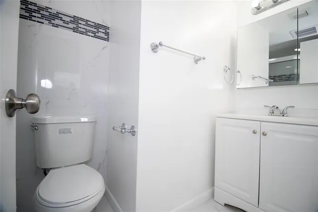 a kitchen with stainless steel appliances wooden cabinets and a sink