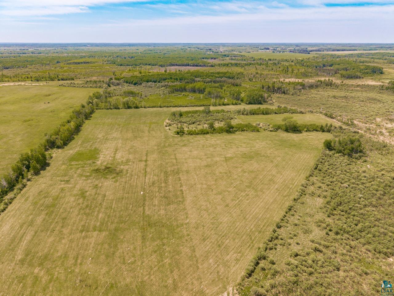 6606 Metso Road Kettle River, MN 55757 - Photo 29 of 84 Expansive undeveloped land featuring a combination of open fields and scattered treed areas