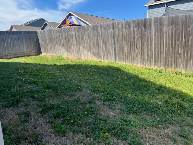 379 Geode Glen Maxwell, TX 78656 - Photo 11 of 12 View of yard featuring a fenced backyard