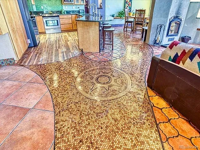 a living room with furniture fireplace and rug