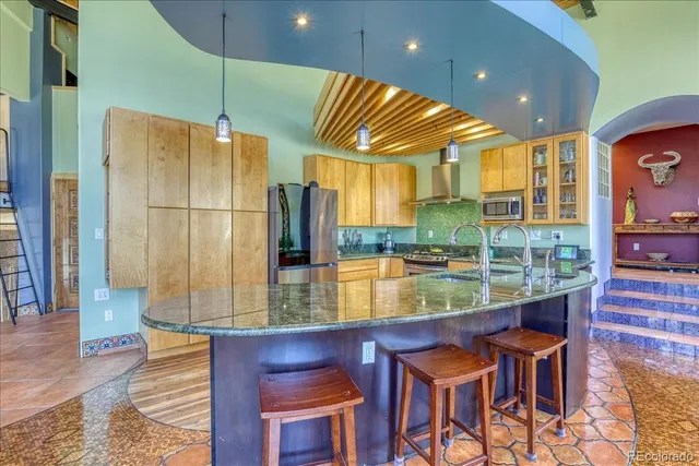 a kitchen with lots of counter space and a sink