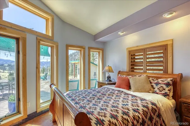 a bedroom with a bed and wall painting