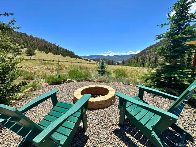 a view of a balcony with chair and wooden floor