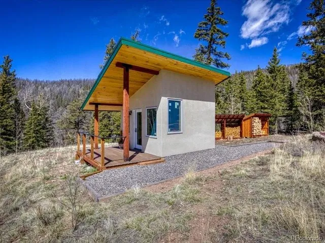 a view of a town with mountains in the background