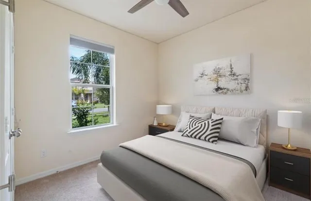 a bedroom with a bed and a window