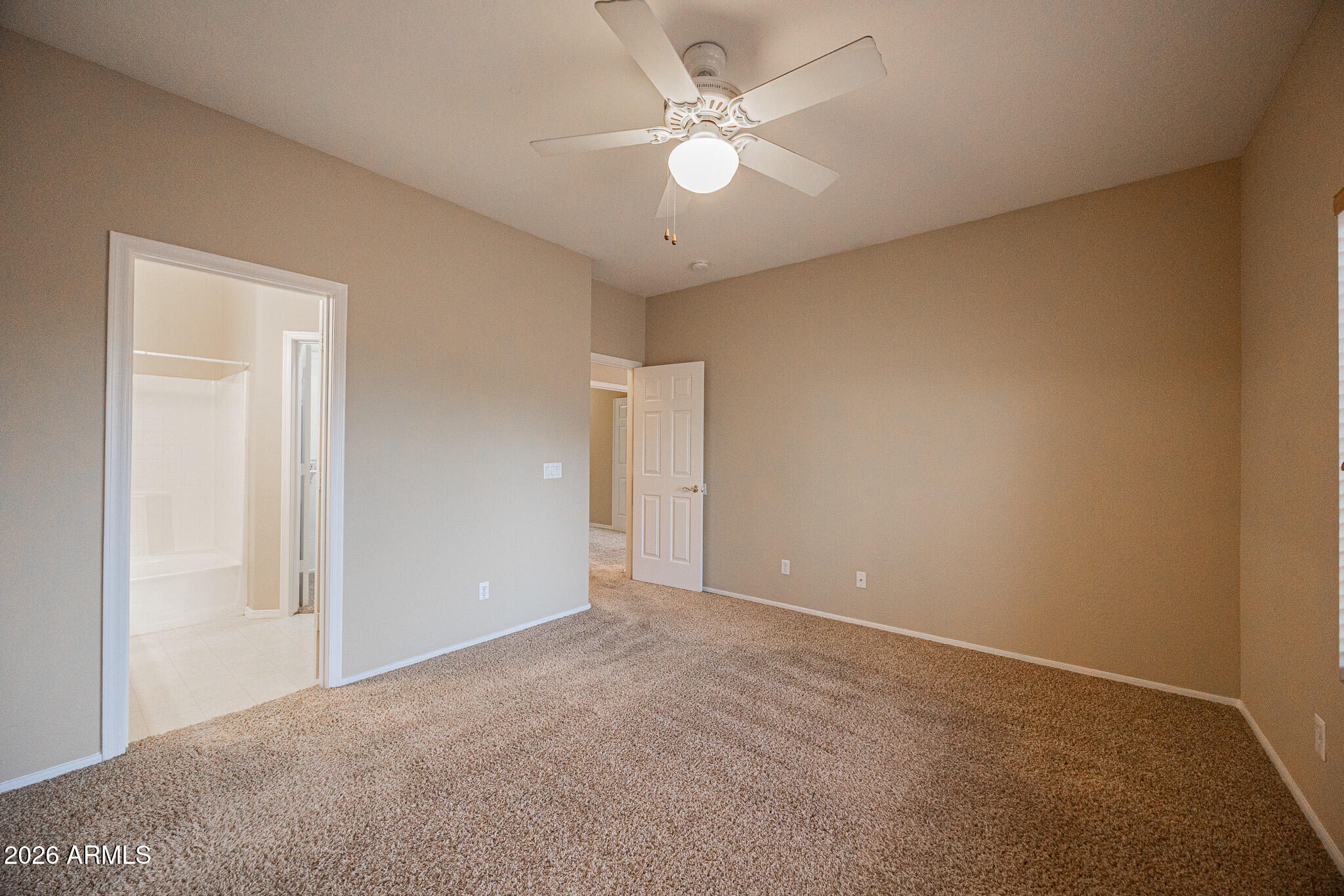 6426 South Nash Way Chandler, AZ 85249 - Photo 12 of 23 a view of an empty room with a ceiling fan