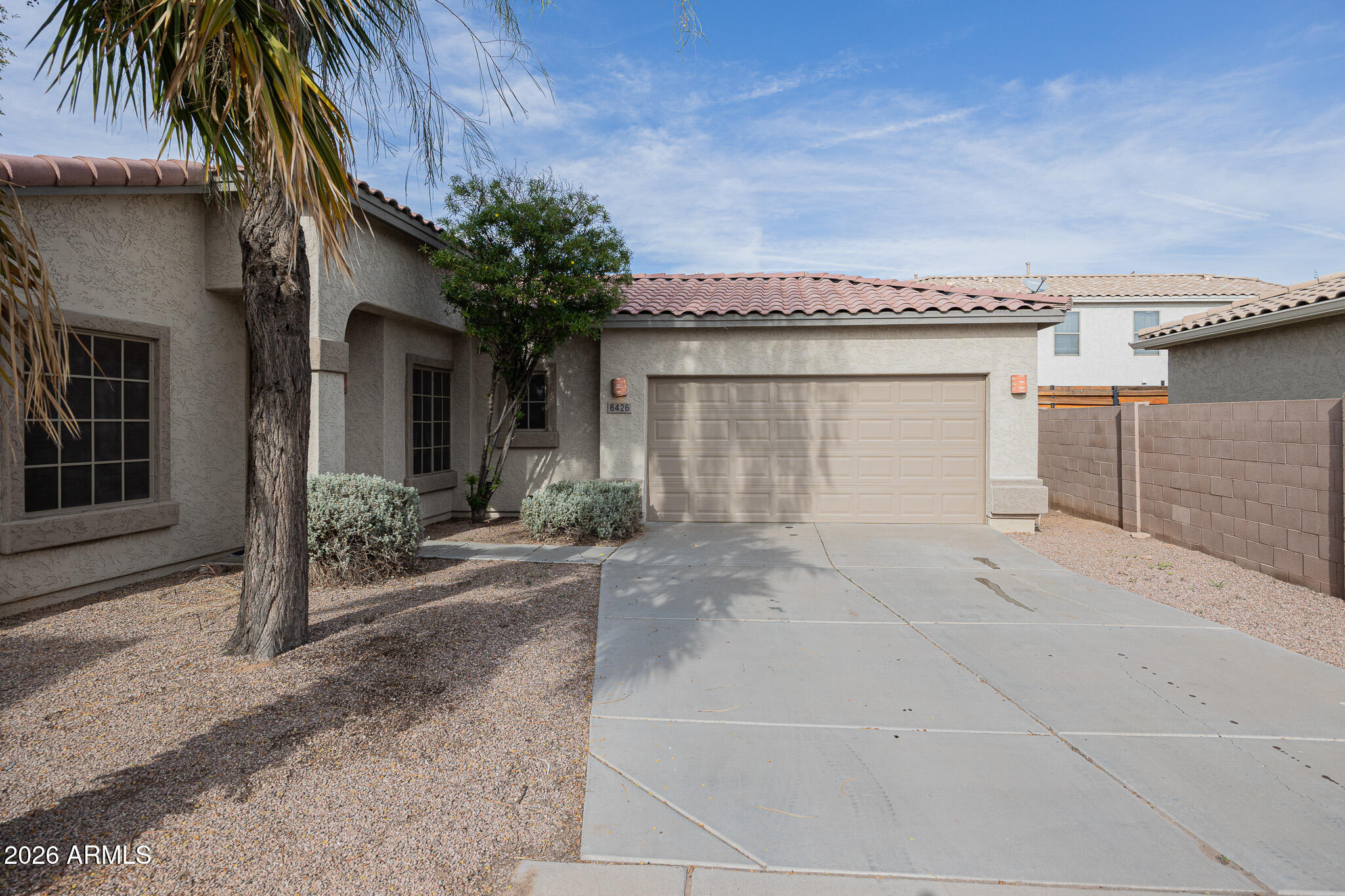 6426 South Nash Way Chandler, AZ 85249 - Photo 2 of 23 a front view of a house with a yard