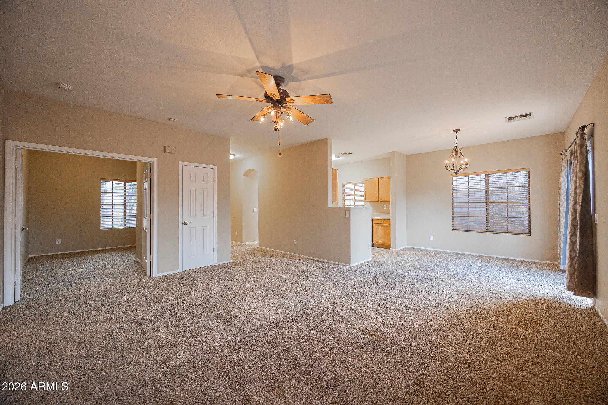 6426 South Nash Way Chandler, AZ 85249 - Photo 5 of 23 a view of a big room with windows and cabinet