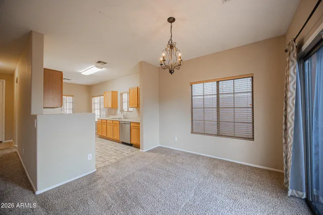 a view of a kitchen with an empty space and kitchen view