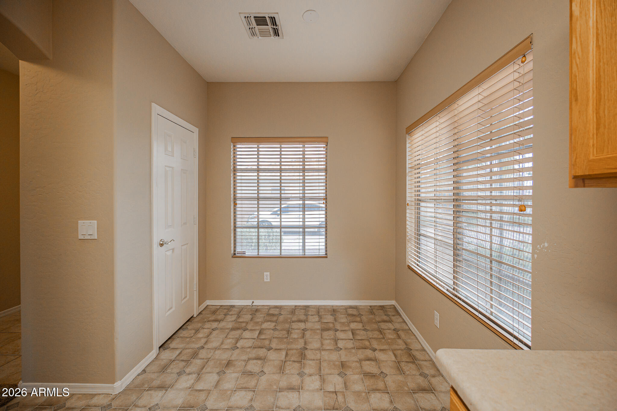 6426 South Nash Way Chandler, AZ 85249 - Photo 9 of 23 a view of an empty room with a window