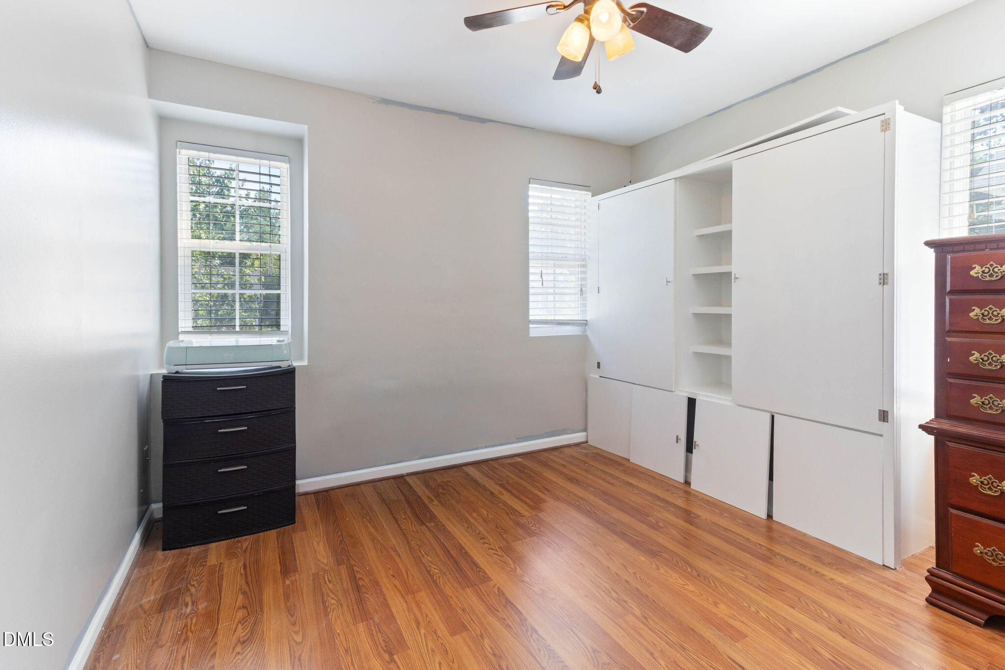 3713 Marshlane Way Raleigh, NC 27610 - Photo 22 of 38 wooden floor in an empty room with a window