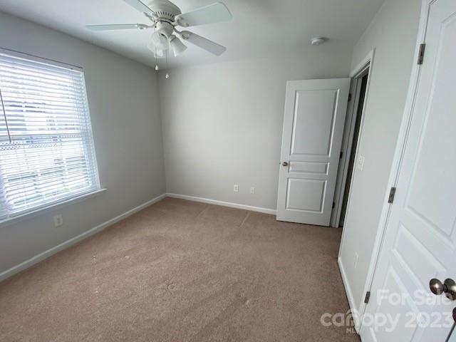 948 Copperstone Lane Fort Mill, SC 29708 - Photo 25 of 34 an empty room with windows and fan