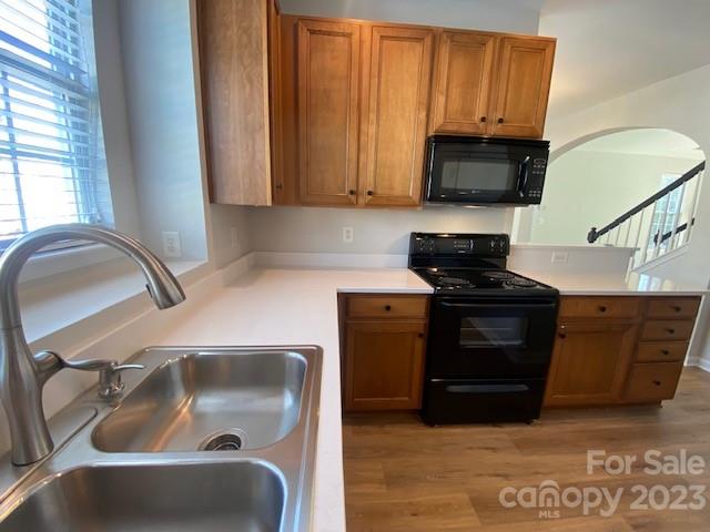 948 Copperstone Lane Fort Mill, SC 29708 - Photo 8 of 34 a kitchen with granite countertop a sink and a stove top oven