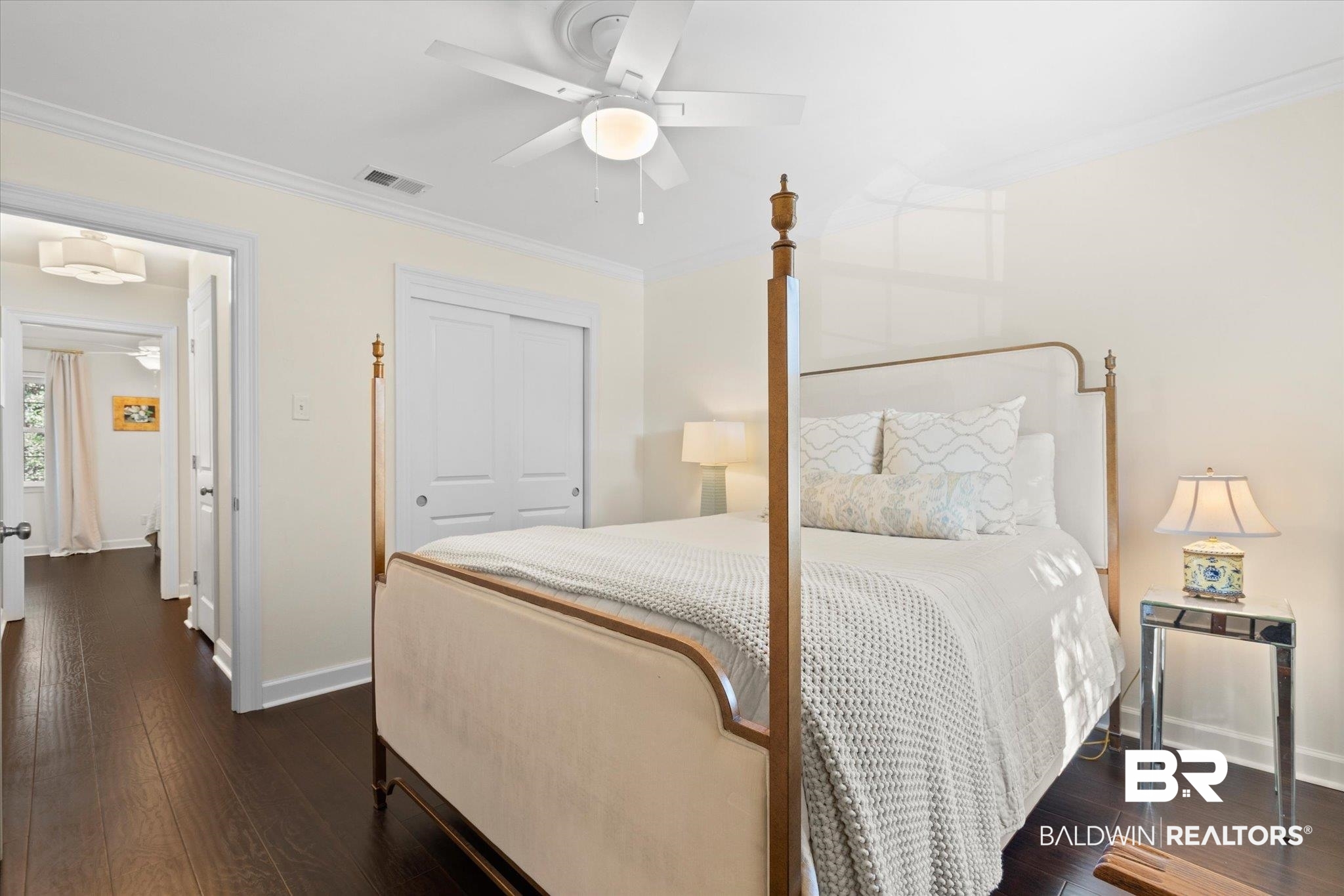 134 Du Rhu Drive, Unit E Mobile, AL 36608 - Photo 24 of 30 Bedroom featuring crown molding, dark wood-type flooring, a closet, and ceiling fan