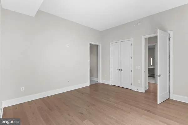 a view of a workspace with furniture and wooden floor