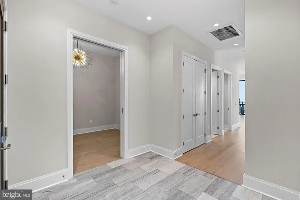 a living room with furniture a flat screen tv and a large window