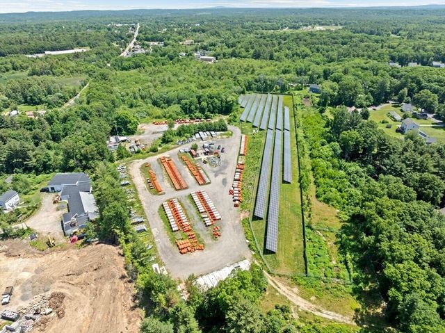 an aerial view of a house with a garden