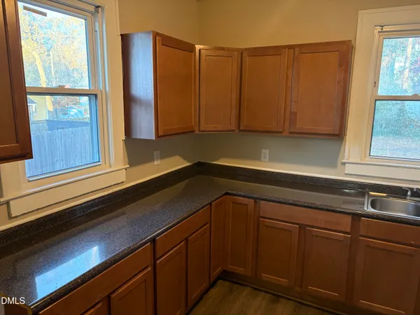 a kitchen with a sink and cabinets